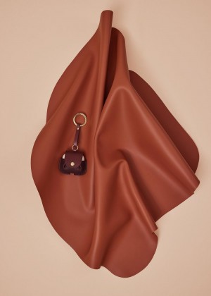 Polène Airpods case Charms Bordeaux | VEJLKG172